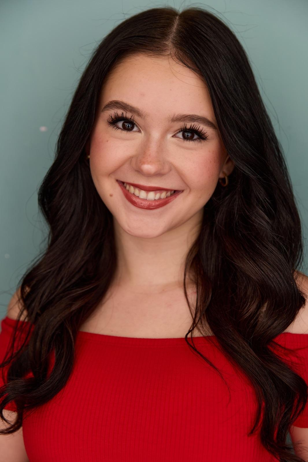 Clara Neag — studio headshot, smiling
