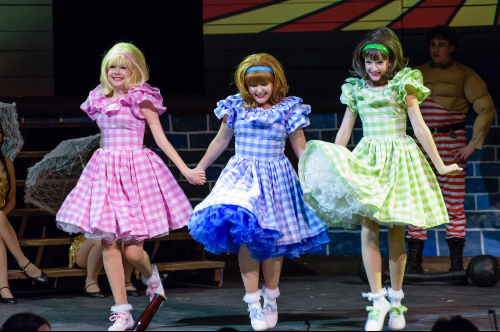 Clara Neag on stage in a group musical number