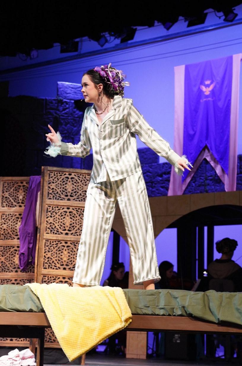 Clara Neag as Princess Winnifred in Once Upon a Mattress, mid-number in striped pajamas